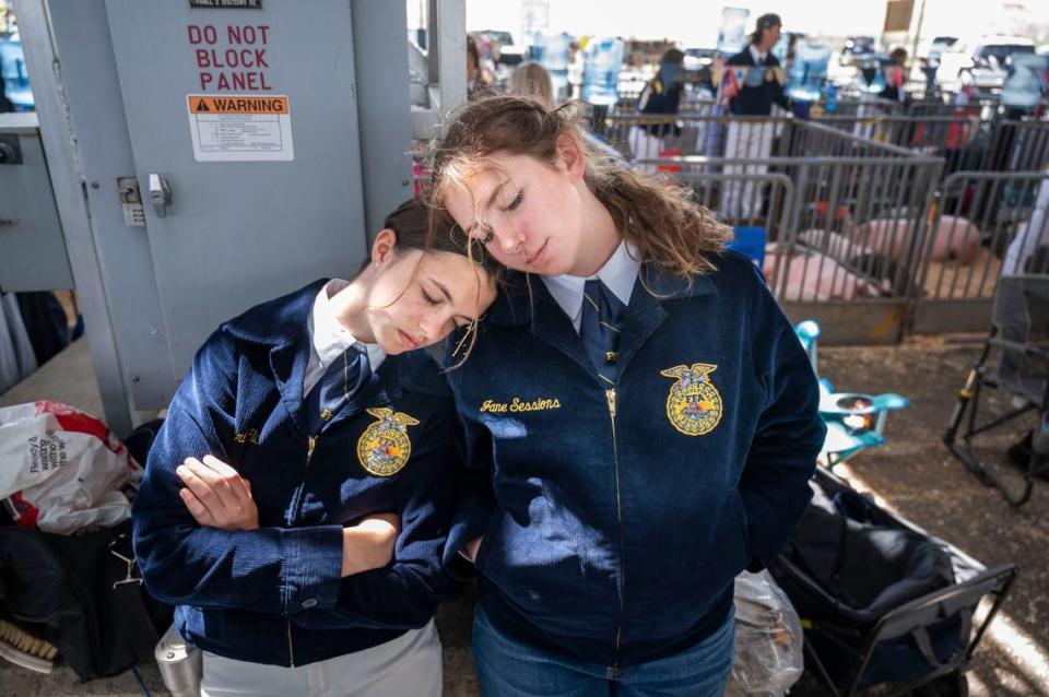 Mari Clift and teammate Jane Sessions, of Elk Grove High School, get a little shut eye on Thursday during the opening day of the Sacramento County Fair at Cal Expo.