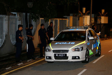 Police arrive outside former prime minister Najib Razak's residence in Kuala Lumpur, Malaysia May 16, 2018. REUTERS/Lai Seng Sin