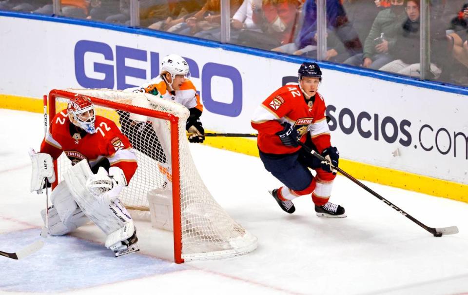 Florida Panthers goaltender Sergei Bobrovsky (72) defends the goal as Panthers defenseman Gustav Forsling (42) skates with the puck against Philadelphia Flyers left wing Oskar Lindblom (23) during the third period of an NHL game at the FLA Live Arena on Wednesday, November 24, 2021 in Sunrise, Fl.