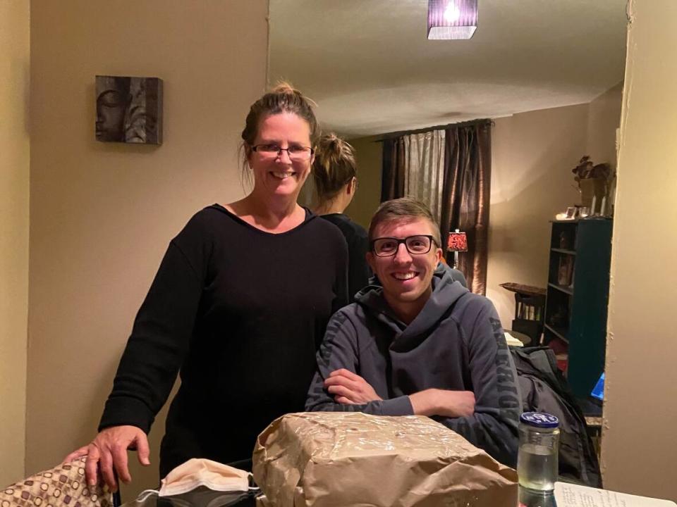 Co-chairs of Books 2 Prisoners Ottawa Jane Crosby, left, and Jeffrey Bradley, right, have accepted book donations at their homes during the pandemic.  (Submitted by Jeffrey Bradley - image credit)