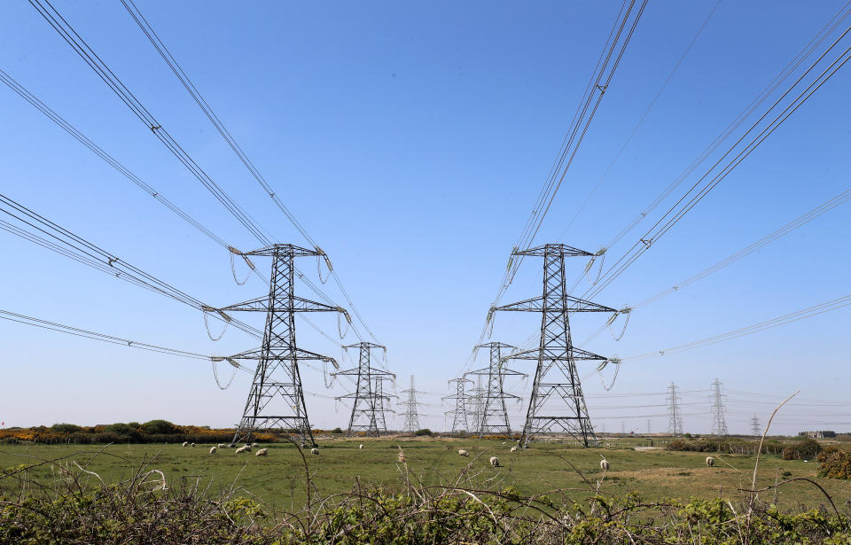 Electricity pylons carry power away from Dungeness nuclear power station in Kent as the National Grid warned that a record low demand for electricity during the UK's coronavirus lockdown could lead to windfarms and power plants being turned off to avoid overloading the electricity grid. (Photo by Gareth Fuller/PA Images via Getty Images)