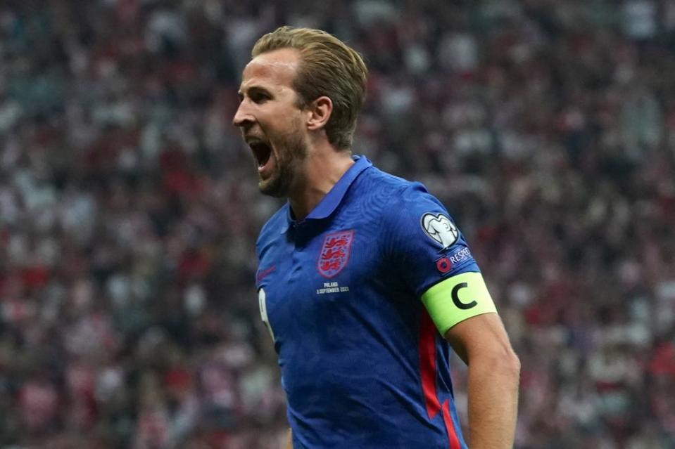 Harry Kane celebrates giving England the lead against Poland in Warsaw  (AFP via Getty Images)