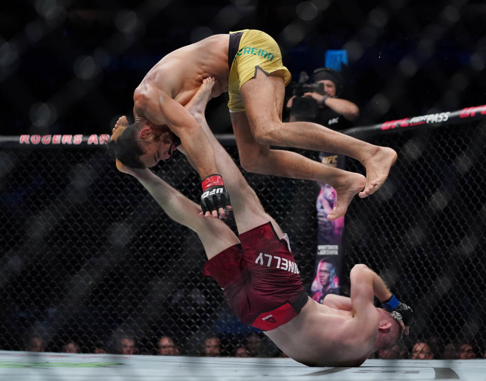 Sep 14, 2019; Vancouver, BC, Canada; Michel Pereira (red gloves) fights Tristan Connelly (blue gloves) during UFC Fight Night at Rogers Arena. Mandatory Credit: Kyle Terada-USA TODAY Sports