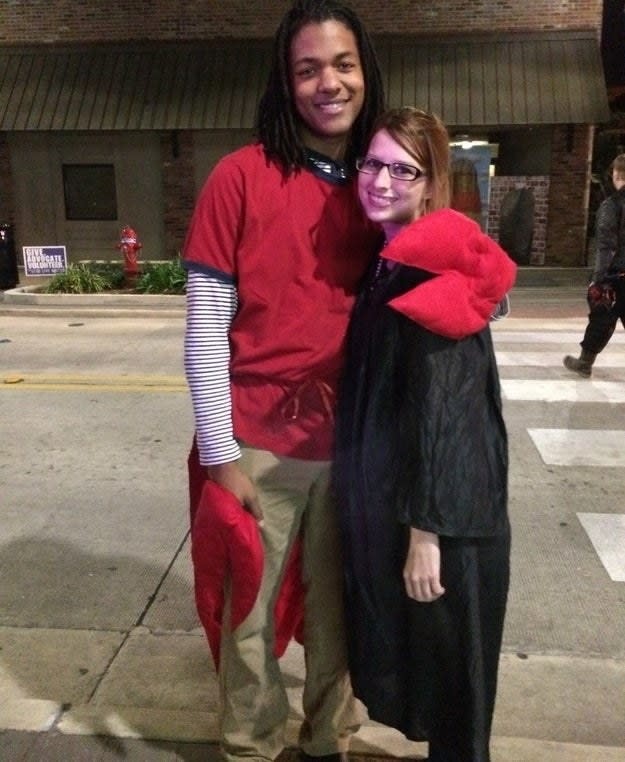 One person dressed as a judge and one person dressed as a lobster