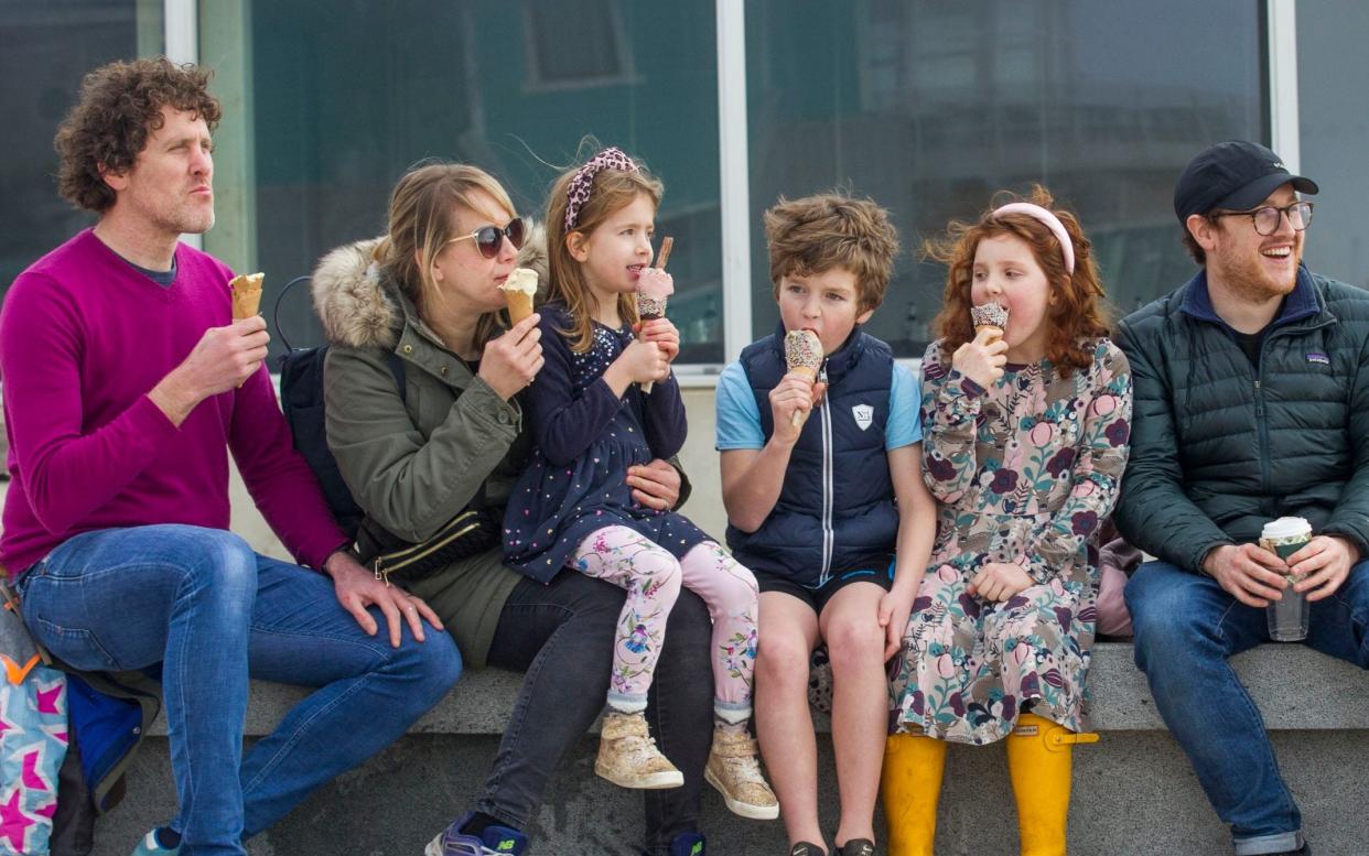 251607236 / f6cbea0d-213a-3557-832b-a36cabe4c5c8 Original description: The Buckland family (permissions granted) enjoy ice creams today as the sun came out on the seafront in Brighton ***Pic by David McHugh / Brighton Pictures 07768 721637*** Source: Brighton Pictures Filename: TELEMMGLPICT000251607236.jpeg - David McHugh/Brighton Pictures