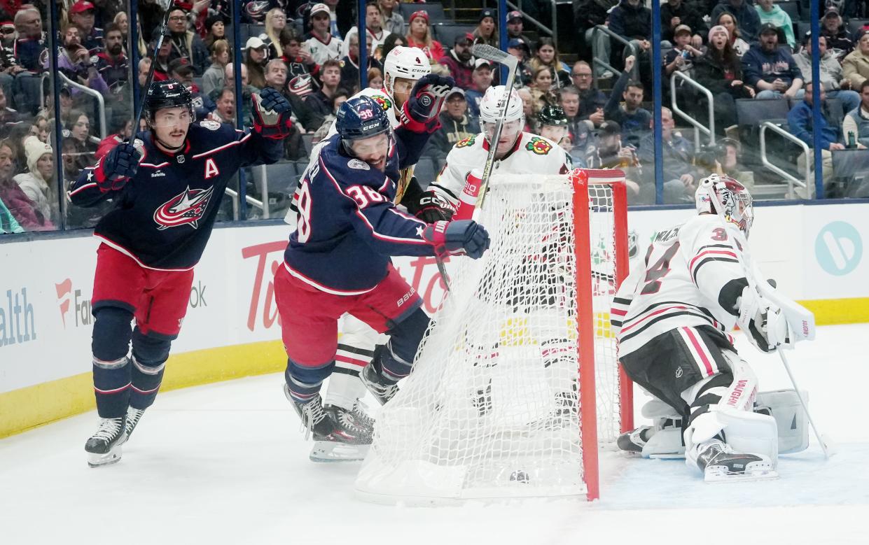Nov 22, 2023; Columbus, Ohio, USA; Columbus Blue Jackets center Boone Jenner (38) watches his puck score as he falls behind the net during the first period of the NHL hockey game at Nationwide Arena in Columbus on November 22, 2023.