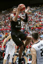 Japan's Rui Hachimura (8) of the Washington Wizards puts up a shot over Germany's Danilo Barthel, right, during the second quarter of their men's international friendly basketball game at Saitama Super Arena in Saitama, near Tokyo, Saturday, Aug. 24, 2019. Japan won 86-83. (Masanori Kumagai/Kyodo News via AP)