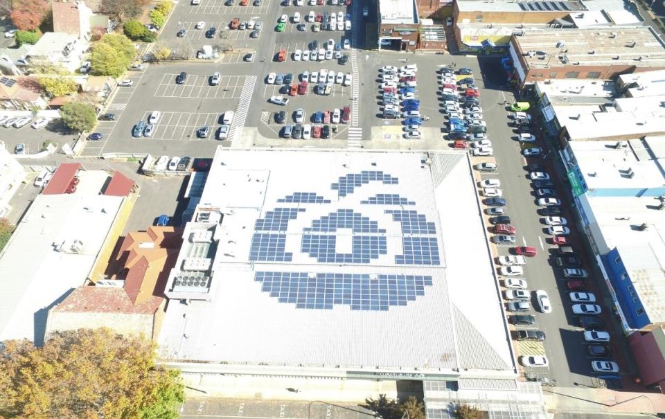 Solar panels make up a Woolworths logo on a store roof. Source: Woolworths Group