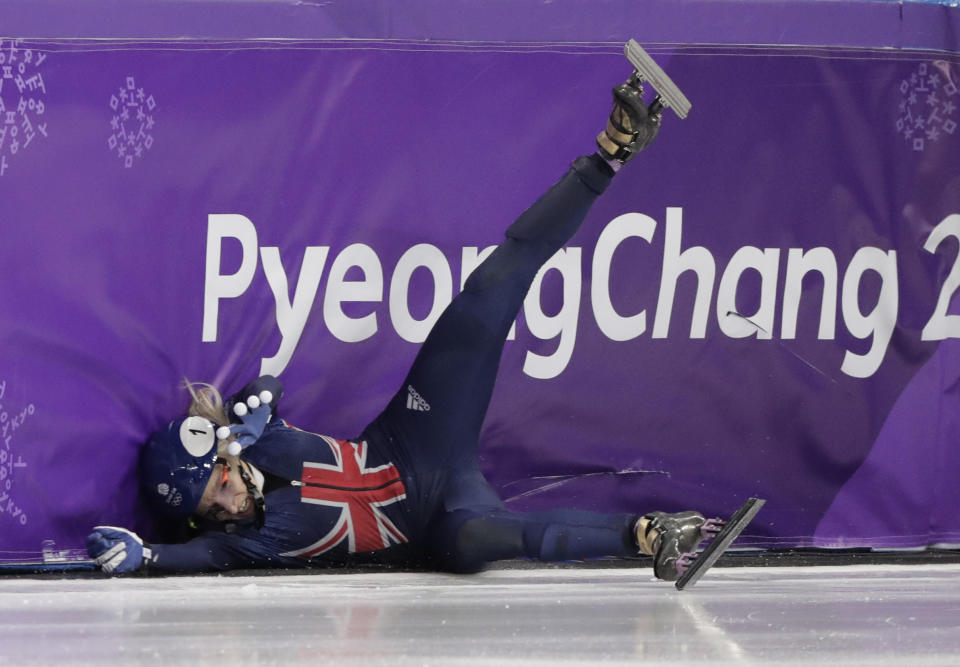 Elise Christie crashes during the 1500-meter semifinal on Saturday. (AP)