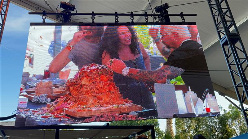 Guy Fieri and the band Old Dominion crafted up trash can nachos during their Stagecoach Smokehouse cooking demo on Saturday.