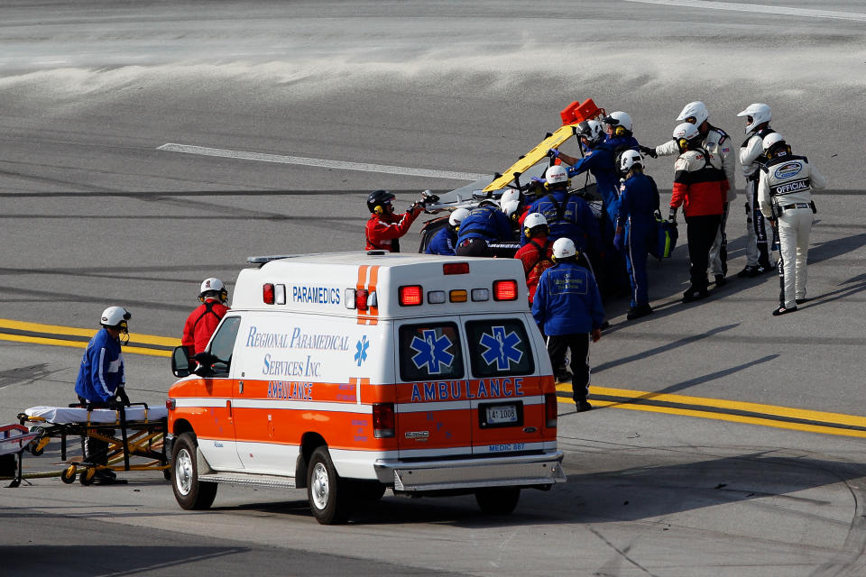 TALLADEGA, AL - MAY 05: Eric McClure, driver of the #14 Hefty/Reynolds Wrap Toyota, receives attention from a medical team after an incident during the NASCAR Nationwide Series Aaron's 312 at Talladega Superspeedway on May 5, 2012 in Talladega, Alabama. (Photo by Chris Graythen/Getty Images for NASCAR)