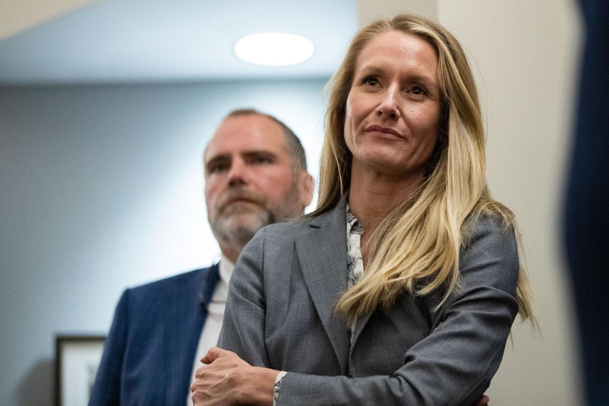 Assistant State Attorney Sarah Dugan listens as her partner, ASA Georgia Cappleman responds to the media after winning their case against Charlie Adelson on Monday, Nov. 6, 2023.