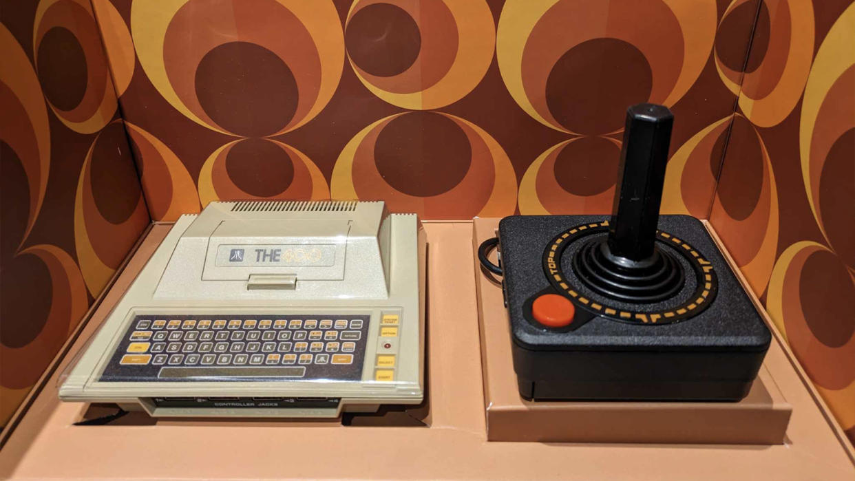  Atari 400 Mini review; a retro console on a retro themed background. 