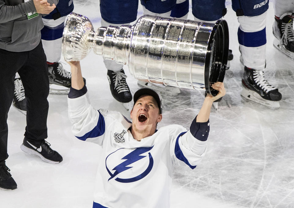 Tampa Bay Lightning's Ondrej Palat (18) hoists the Stanley Cup after defeating the Dallas Stars in Edmonton, Alberta, on Monday, Sept. 28, 2020. (Jason Franson/The Canadian Press via AP)