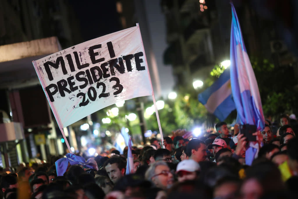  Supporters of presidential candidate for La Libertad Avanza Javier Milei celebrate after the polls closed in the presidential runoff on November 19, 2023 in Buenos Aires, Argentina. 