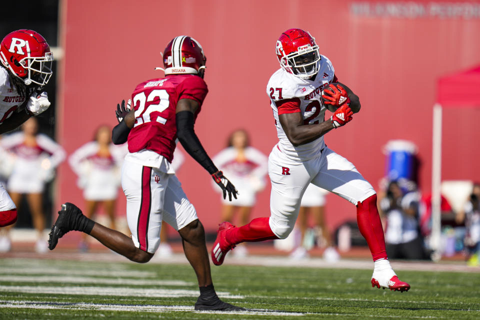 Rutgers running back Samuel Brown V (27) tries to get past Indiana defensive back Jamari Sharpe (22) during the second half of an NCAA college football game in Bloomington, Ind., Saturday, Oct. 21, 2023. Rutgers defeated Indiana 31-14. (AP Photo/Michael Conroy)