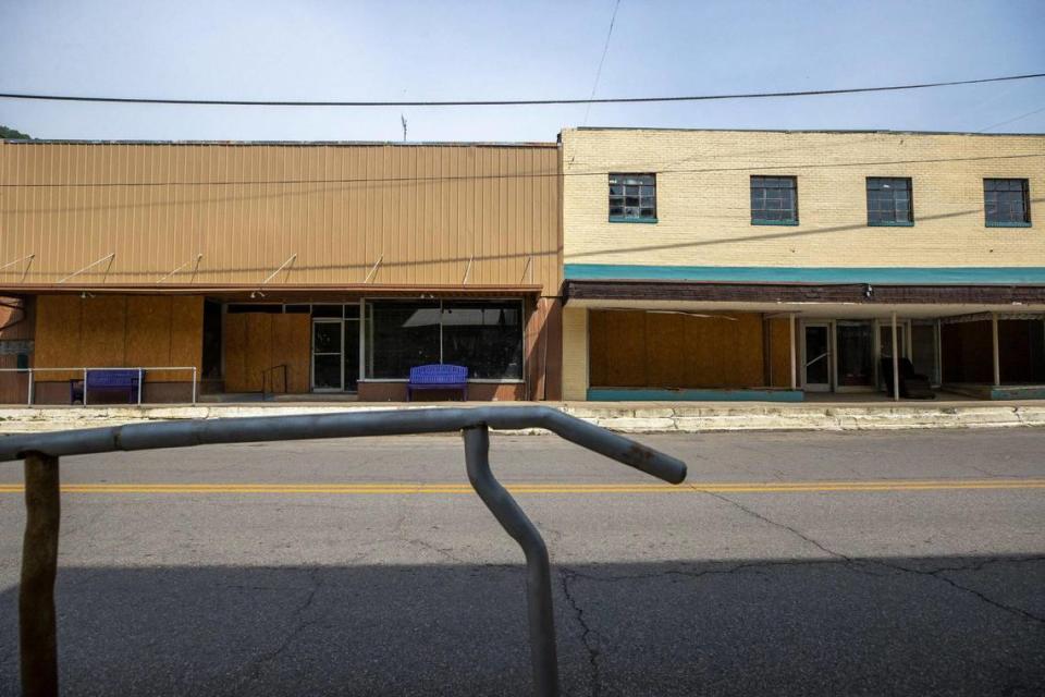 Windows are boarded up in downtown Fleming-Neon on Thursday, June 29, 2023. Flooding last summer devastated the community in Letcher County.