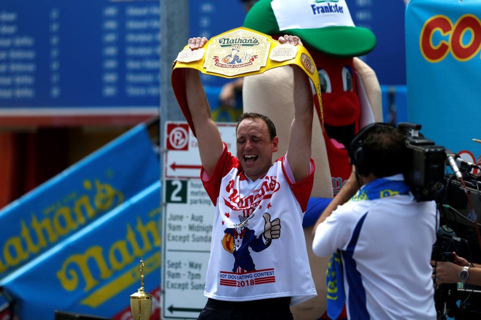 Joey Chestnut celebrates his victory.