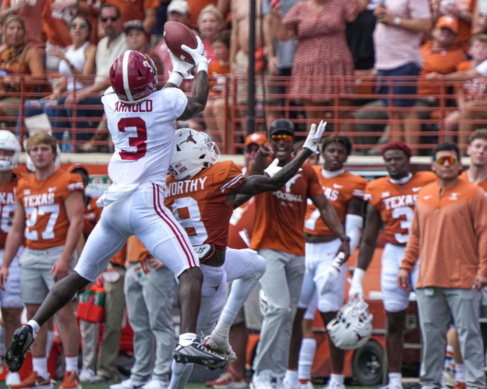 Alabama defensive back Terrion Arnold jumps to intercept a pass over Texas receiver Xavier Worthy at Royal Memorial Stadium on Sept. 10, 2022.