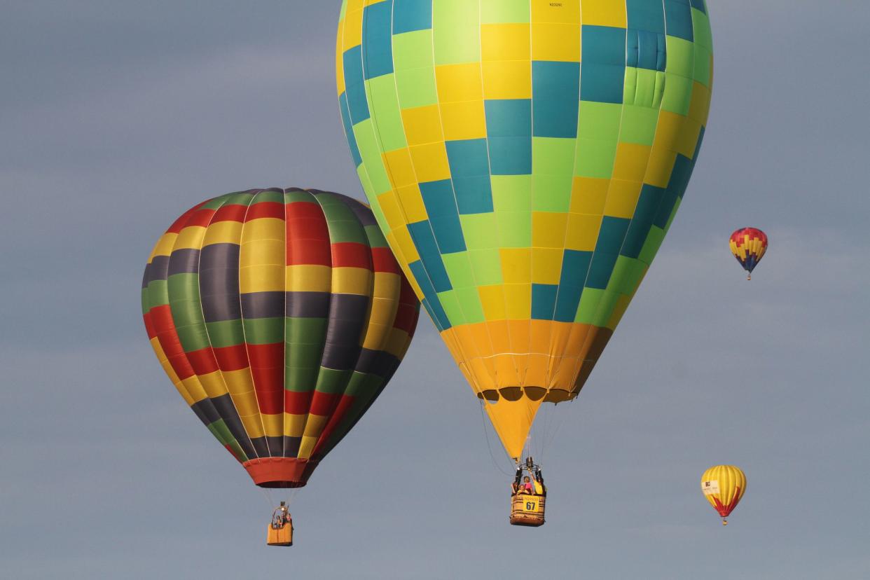 Indianola, IA, USA - Aug. 2, 2016: Hot air balloons float above Indianola, Iowa, during the National Balloon Classic on July 30.