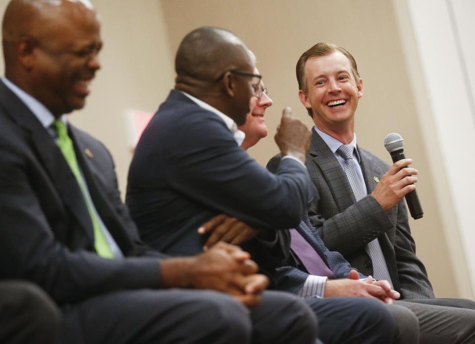 Kyle South, right, jokes with state Sen. Bobby Singleton of Greensboro on July 10, 2019, during the annual State of the State luncheon at the Embassy Suites hotel in Tuscaloosa.