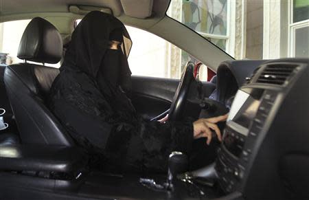 A woman drives a car in Saudi Arabia