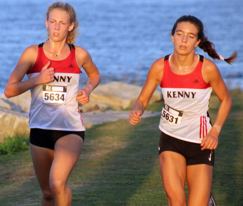 Bishop Kenny's Davis Johnson (5634) and Alexis Holmes (5631) race during the FHSAA District 2-2A high school girls cross country meet.