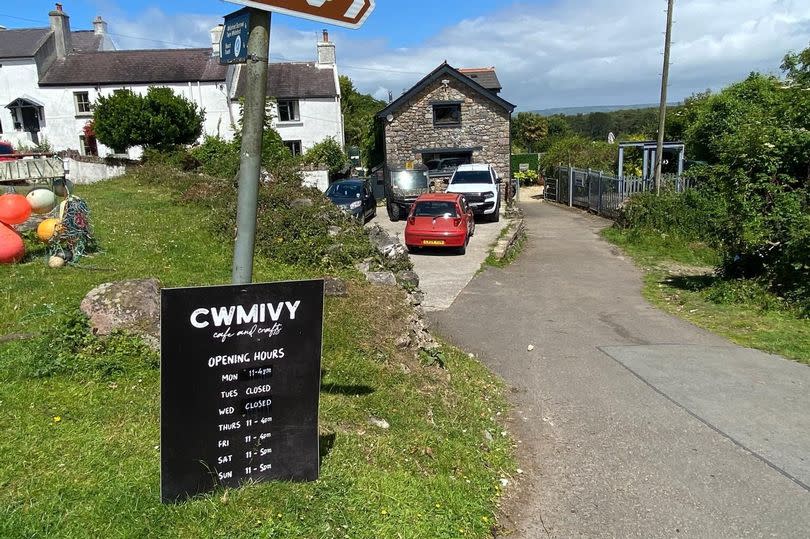 village scene with sign