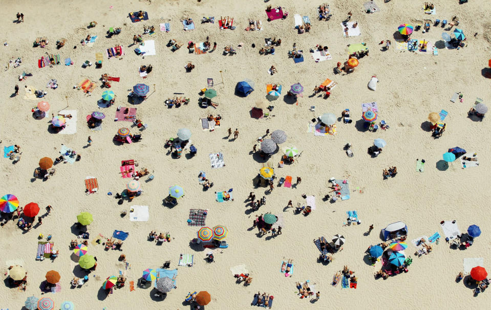 Scorching heat waves swept across the U.S., topping records and sending many to beaches for a reprieve. The U.N.'s World Meteorological Organization concluded 2012 will be one of the warmest years on record. (Mario Tama/Getty Images)