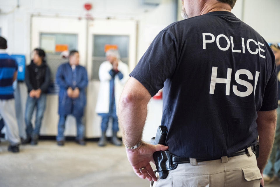 ICE officers in the homeland security investigations (HSI) unit look on after executing search warrants and making arrests at an agricultural processing facility in Canton, Mississippi, on Aug. 7, 2019. (Photo: Handout / Reuters)