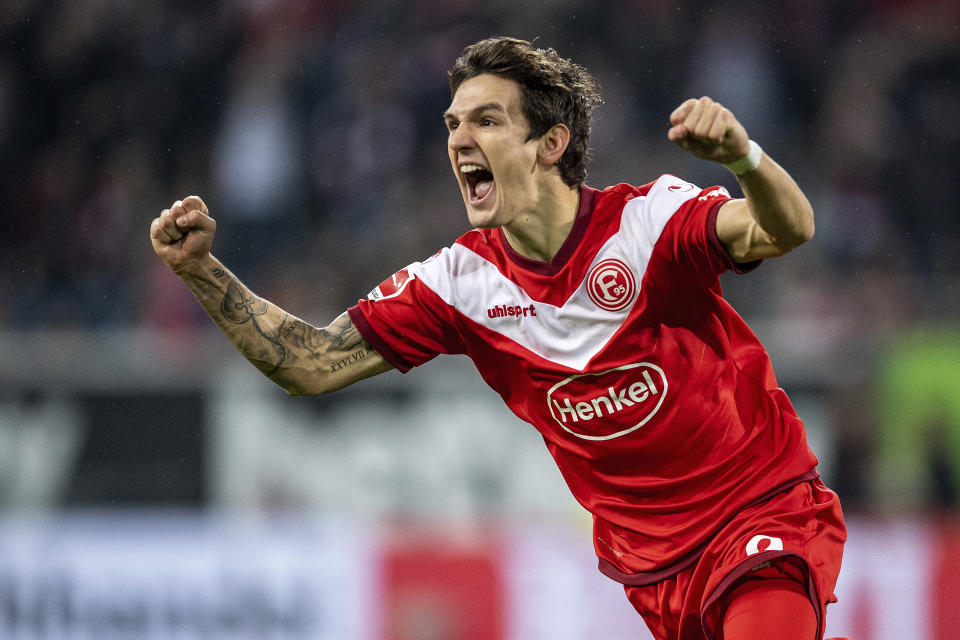 Duesseldorf's Benito Raman celebrates after scoring during the German Bundesliga soccer match in Freiburg, Germany, Saturday, Nov. 10, 2018. (Patrick Seeger/dpa via AP)