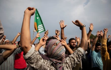 The Wider Image: Barricades and books in restive Kashmir neighbourhood