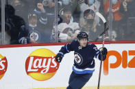 Winnipeg Jets' Nikolaj Ehlers celebrates his goal against the New Jersey Devils during the second period of an NHL hockey game Friday, Dec. 3, 2021, in Winnipeg, Manitoba. (John Woods/The Canadian Press via AP)