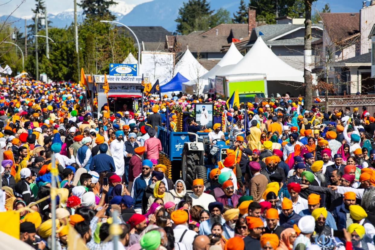 People are pictured at the Surrey Vaisakhi Parade in 2023. This year's edition of the parade is expected to attract 500,000 people, organizers say. (Ben Nelms/CBC - image credit)