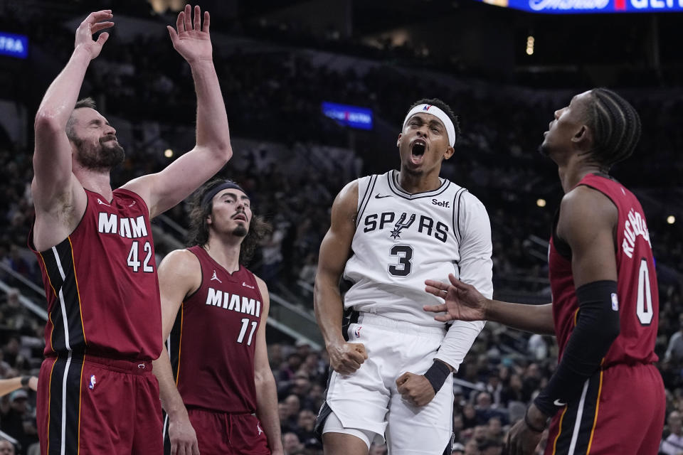 San Antonio Spurs forward Keldon Johnson (3) reacts after a play against the Miami Heat during the second half of an NBA basketball game in San Antonio, Sunday, Nov. 12, 2023. (AP Photo/Eric Gay)