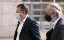 Britain's chief negotiator David Frost, left, arrives for a meeting at EU headquarters in Brussels, Sunday, Dec. 13, 2020. Facing yet another self-imposed Brexit deadline on Sunday, the chief negotiators from the European Union and United Kingdom were making last-ditch efforts to scale differences on a trade deal that have proved insurmountable for the best part of the year. (AP Photo)