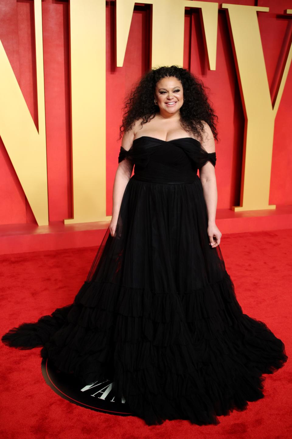 Image may contain: Michelle Buteau, Fashion, Adult, Person, Clothing, Dress, Premiere, and Red Carpet