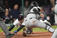 Cleveland Indians' Andres Gimenez, left, scores ahead of the tag from Chicago White Sox catcher Zack Collins in the sixth inning in the second baseball game of a doubleheader, Thursday, Sept. 23, 2021, in Cleveland. The Indians won 5-3. (AP Photo/Tony Dejak)