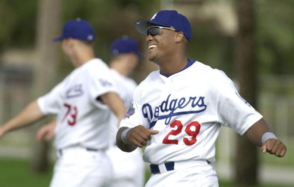 Los Angeles Dodgers third baseman Adrian Beltre laughs while loosening up before the first full squad practice Wednesday Feb. 20, 2002 in Vero Beach, Fla.