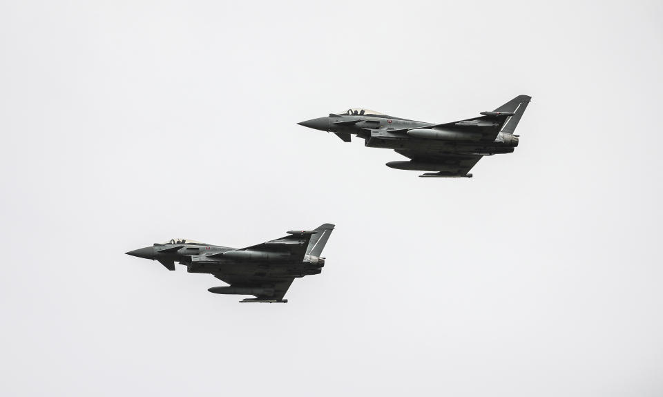 Italian Eurofighters fly over, during an inauguration ceremony at an airbase, in Kocuve, about 85 kilometers (52 miles) south of Tirana, Albania, Monday, March 4, 2024. NATO member Albania inaugurated an international tactic air base on Monday, the Alliance’s first one in the Western Balkan region. (AP Photo/Armando Babani)