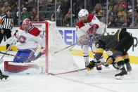 Montreal Canadiens goaltender Carey Price blocks a shot by Vegas Golden Knights left wing William Carrier, right, during the second period in Game 2 of an NHL hockey Stanley Cup semifinal playoff series, Wednesday, June 16, 2021, in Las Vegas. (AP Photo/John Locher)