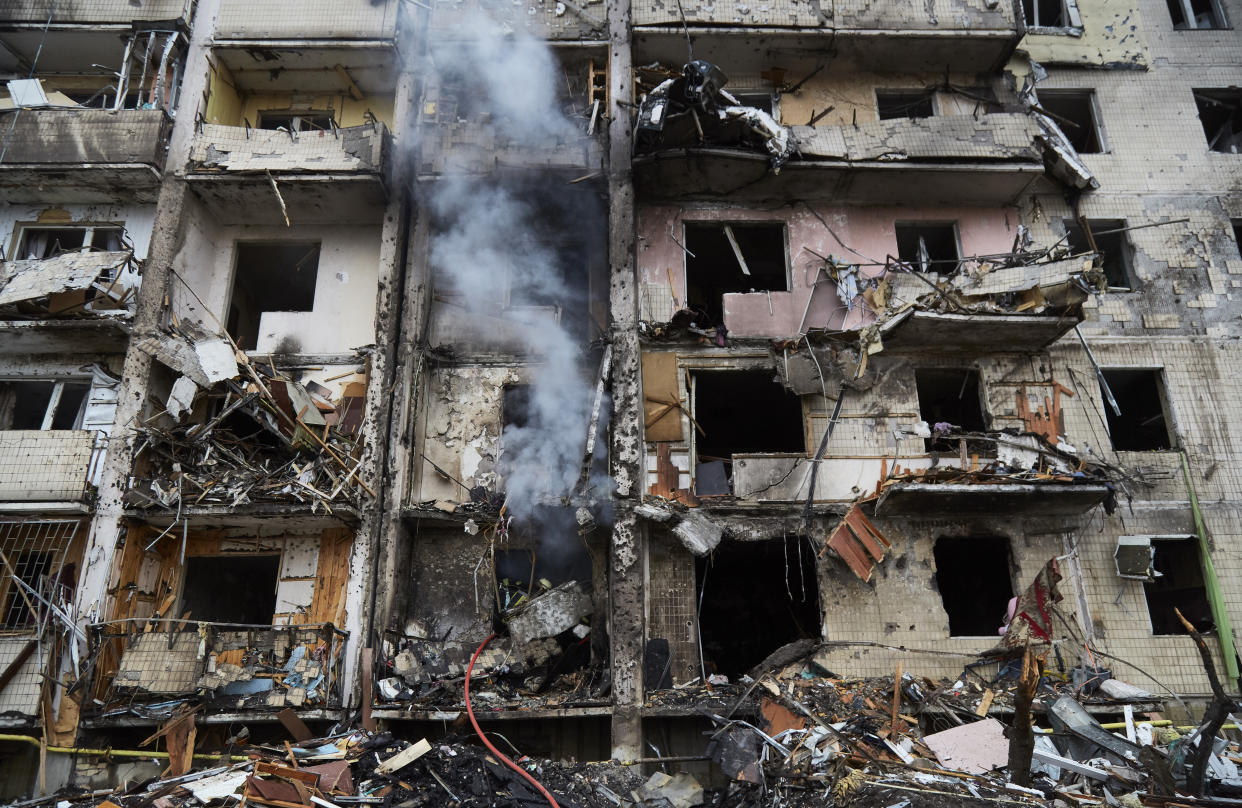 KYIV, UKRAINE - FEBRUARY 25: Firemen extinguish a fire inside a residential building that was hit by a missile on February 25, 2022 in Kyiv, Ukraine. Yesterday, Russia began a large-scale attack on Ukraine, with Russian troops invading the country from the north, east and south, accompanied by air strikes and shelling. The Ukrainian president said that at least 137 Ukrainian soldiers were killed by the end of the first day.  (Photo by Pierre Crom/Getty Images)