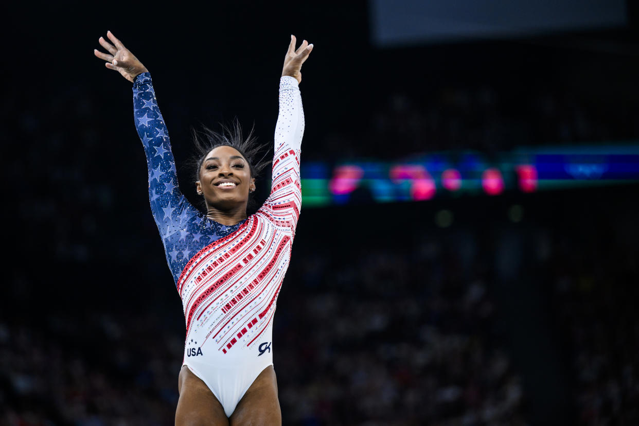 Simone Biles nails a dismount from the balance beam during the team final at the Olympics in Paris.