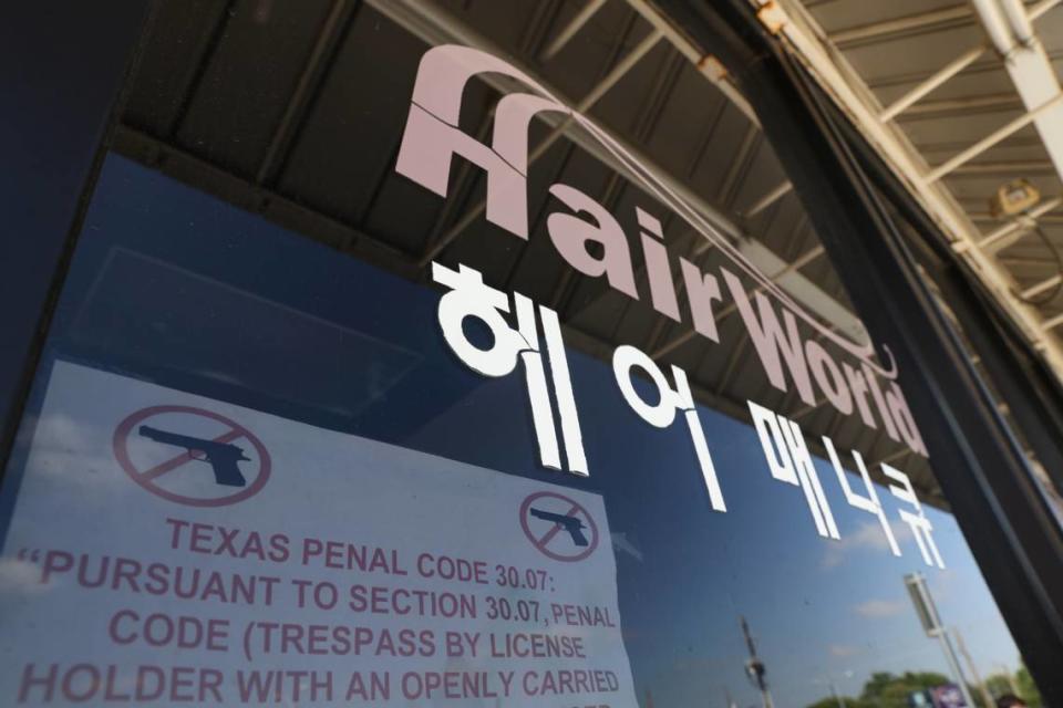 This photo shows the exterior of Hair World Salon on Thursday, May 12, 2022 in Dallas. Dallas’ police chief said Friday, May 13, 2022 that a shooting that injured three women in a hair salon in the city’s Koreatown might have been a hate crime as he announced that it could be connected to two other shootings at businesses run by Asian Americans. (Rebecca Slezak/The Dallas Morning News via AP)