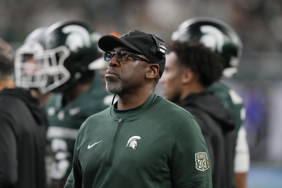 Michigan State interim head coach Harlon Barnett walks on the field during the first half of an NCAA college football game against Penn State, Friday, Nov. 24, 2023, in Detroit. (AP Photo/Carlos Osorio)