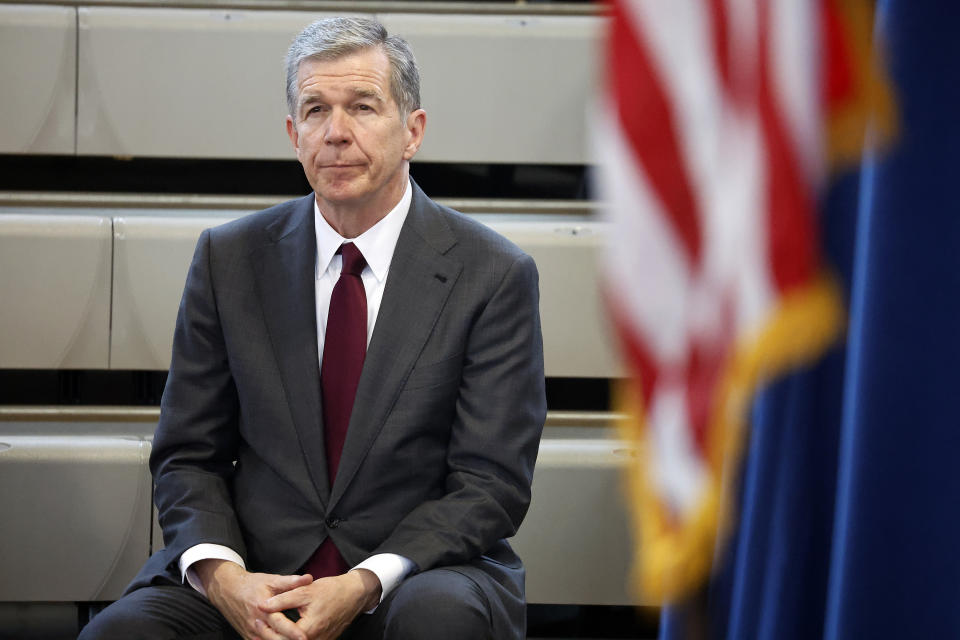 North Carolina Governor Roy Cooper listens as democratic gubernatorial candidate Josh Stein speaks at a rally at Shaw University in Raleigh, N.C., Tuesday, Oct. 10, 2023. (AP Photo/Karl B DeBlaker)