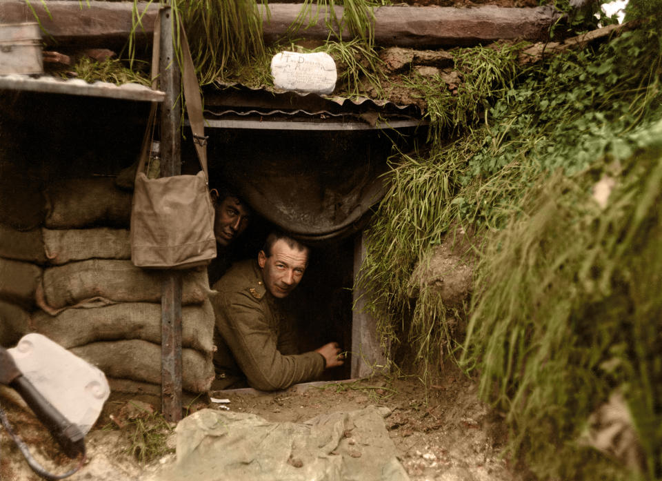 <p>Two New Zealand soldiers look out of a dugout at the front line, Hebuterne in France. (Tom Marshall/mediadrumworld.com) </p>