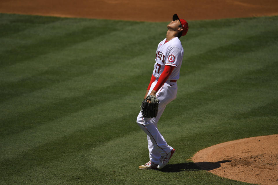 Los Angeles Angels pitcher Shohei Ohtani, of Japan, reacts as he walks in a run during the second inning of a baseball game against the Houston Astros on Sunday, Aug. 2, 2020, in Anaheim, Calif. (AP Photo/Mark J. Terrill)