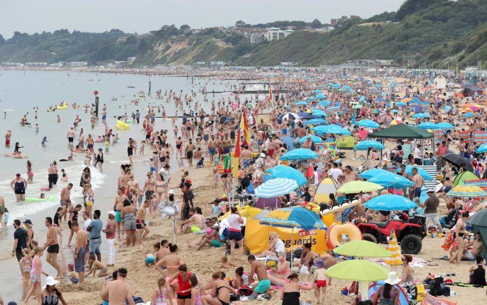 Heatwave: Sun worshippers flocked to the UK's beaches over the weekend (PA)