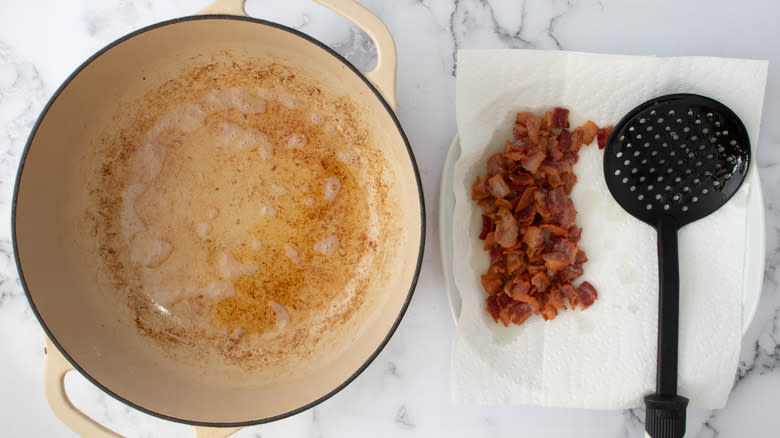cooked bacon draining by pot